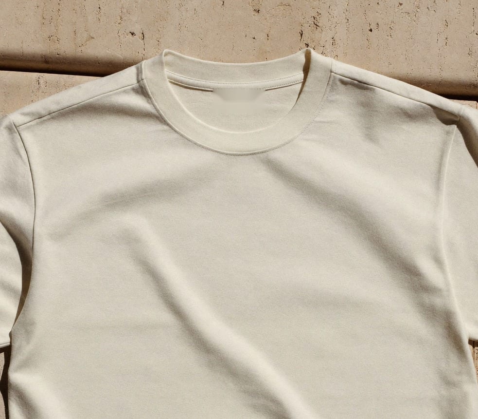 The rib collar and shoulder seams flat on pool stone — no woven label, nothing to scratch