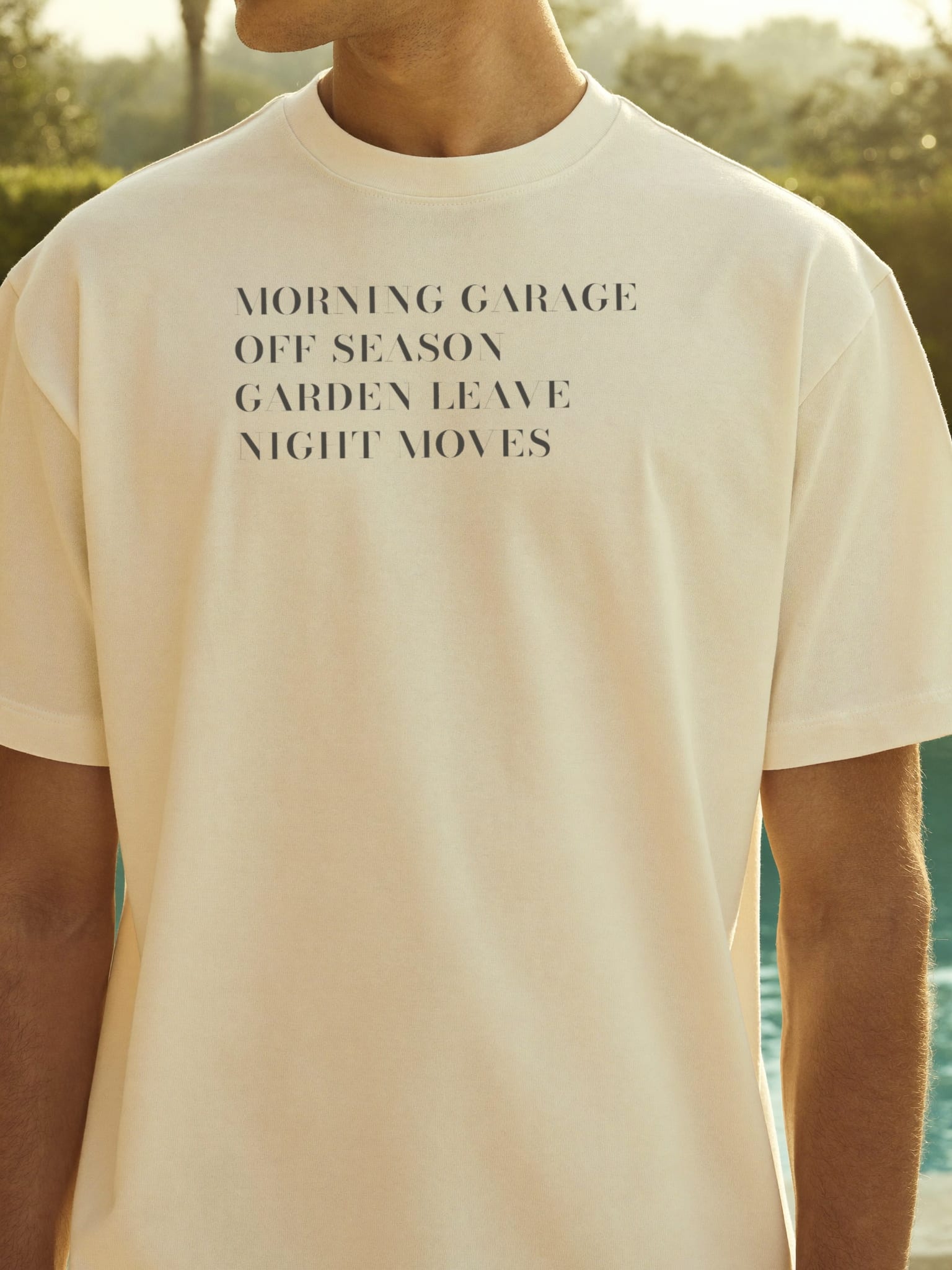 The List worn by the villa pool at midday, the four-line index printed high across the chest.